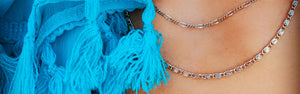 Model wearing two Inch of Silver chain necklaces
